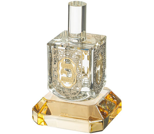 Silver and gold crystal dreidel on glass base, Nes Gadol Hayah Poh